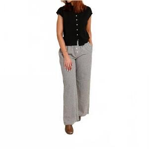 NEW THINGS BETWEEN cult sleeveless cardigan in black